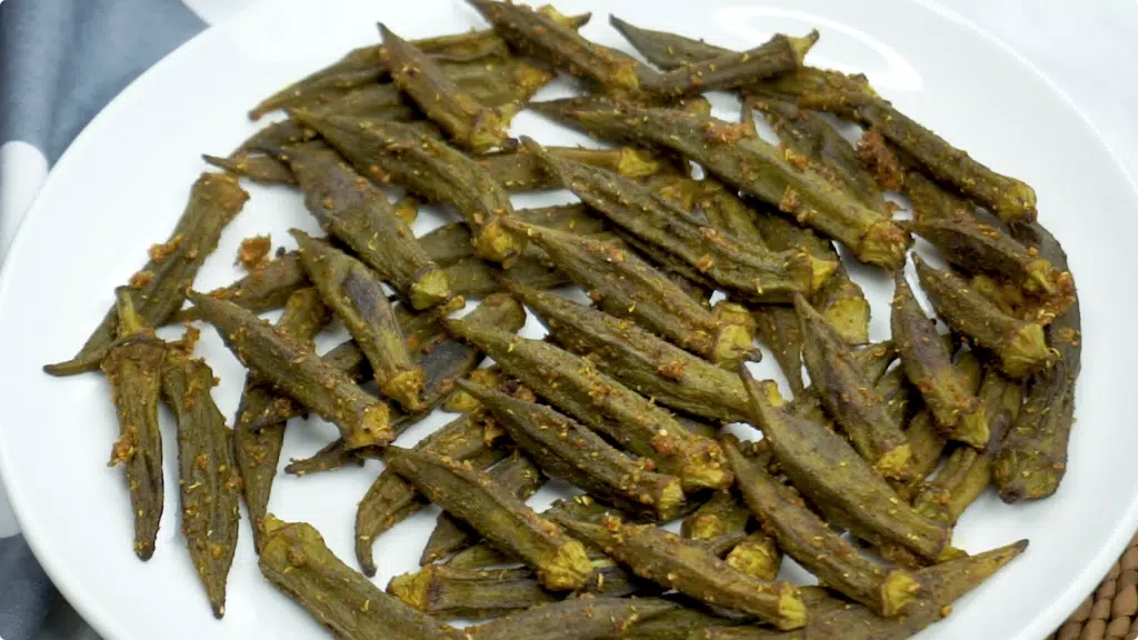 Roasted okra in a plain white plate