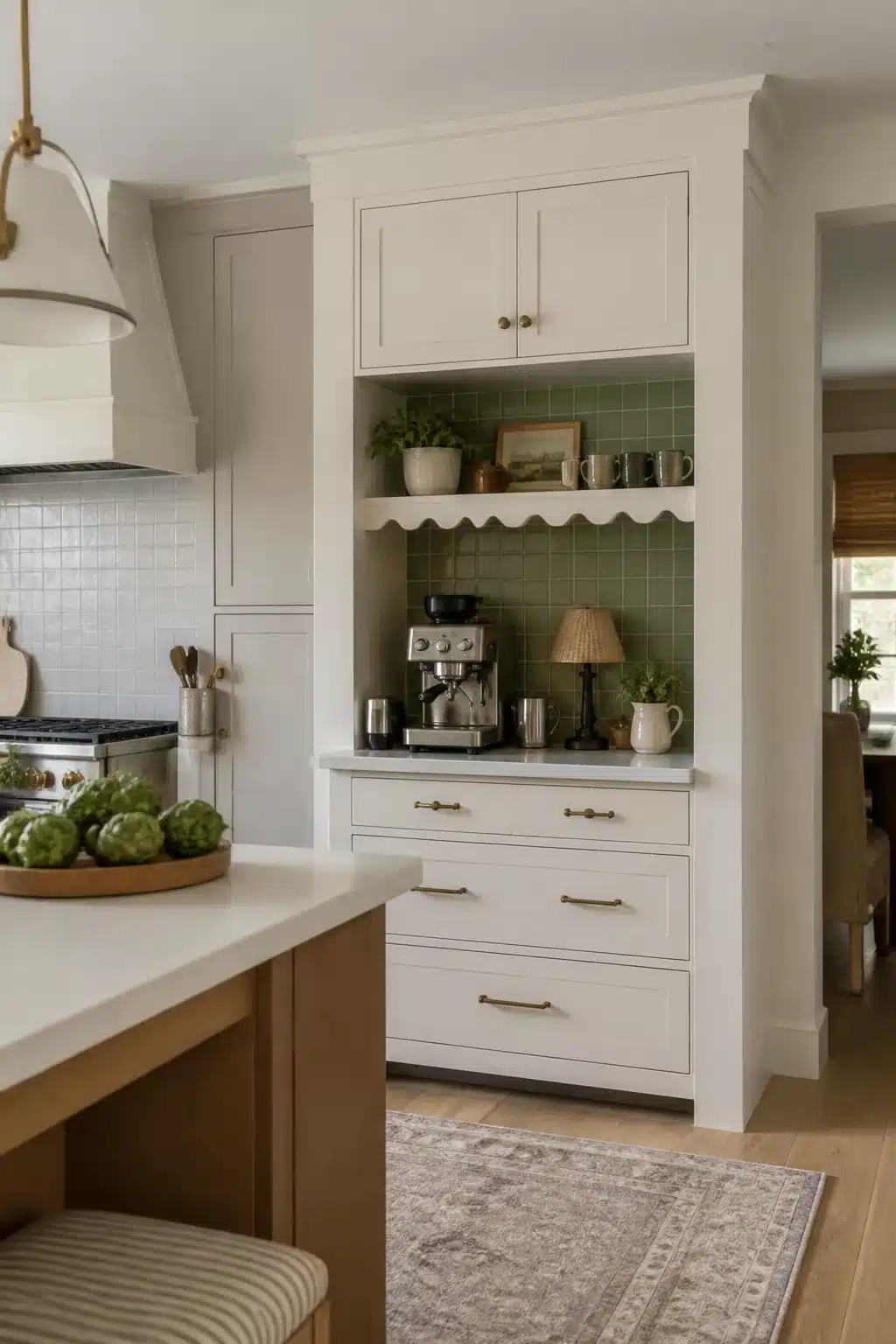 Built in kitchen coffee bar with scalloped shelf edge, green tile backsplash, and cream shaker cabinets