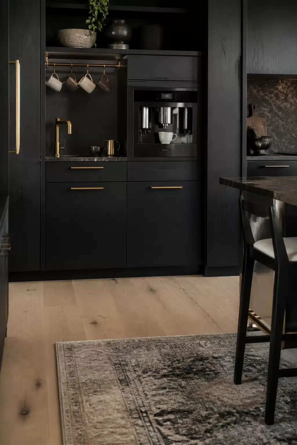 Built in kitchen coffee bar with matte black cabinetry, brass mug rail, and integrated espresso machine