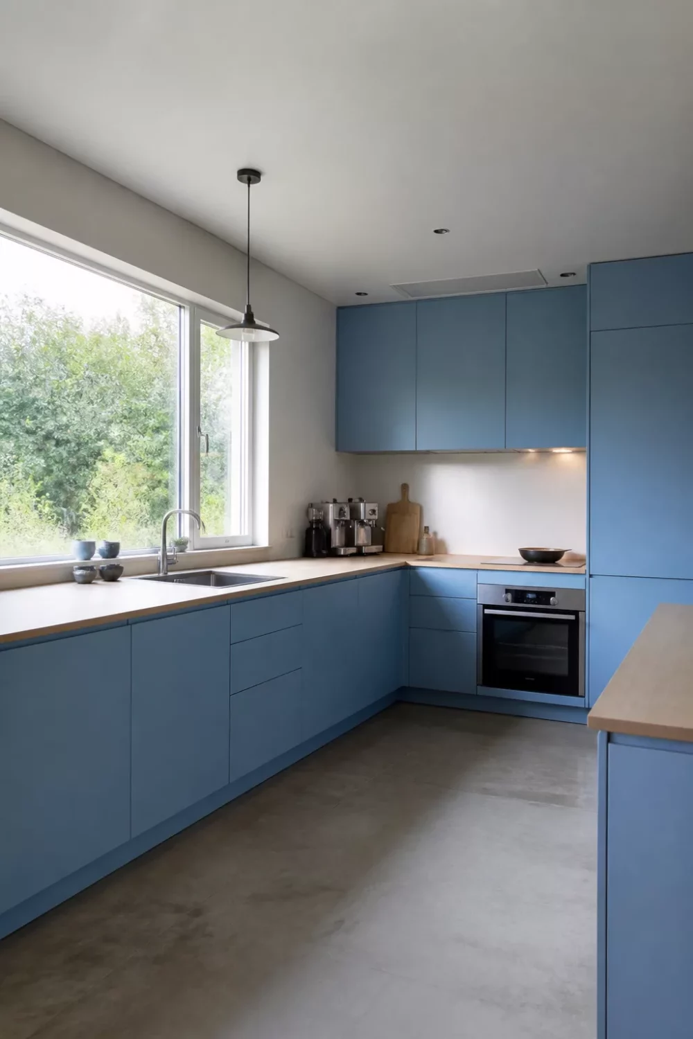 Baby blue handleless cabinets with birch plywood countertops — blue kitchens with wood countertops at their most minimal