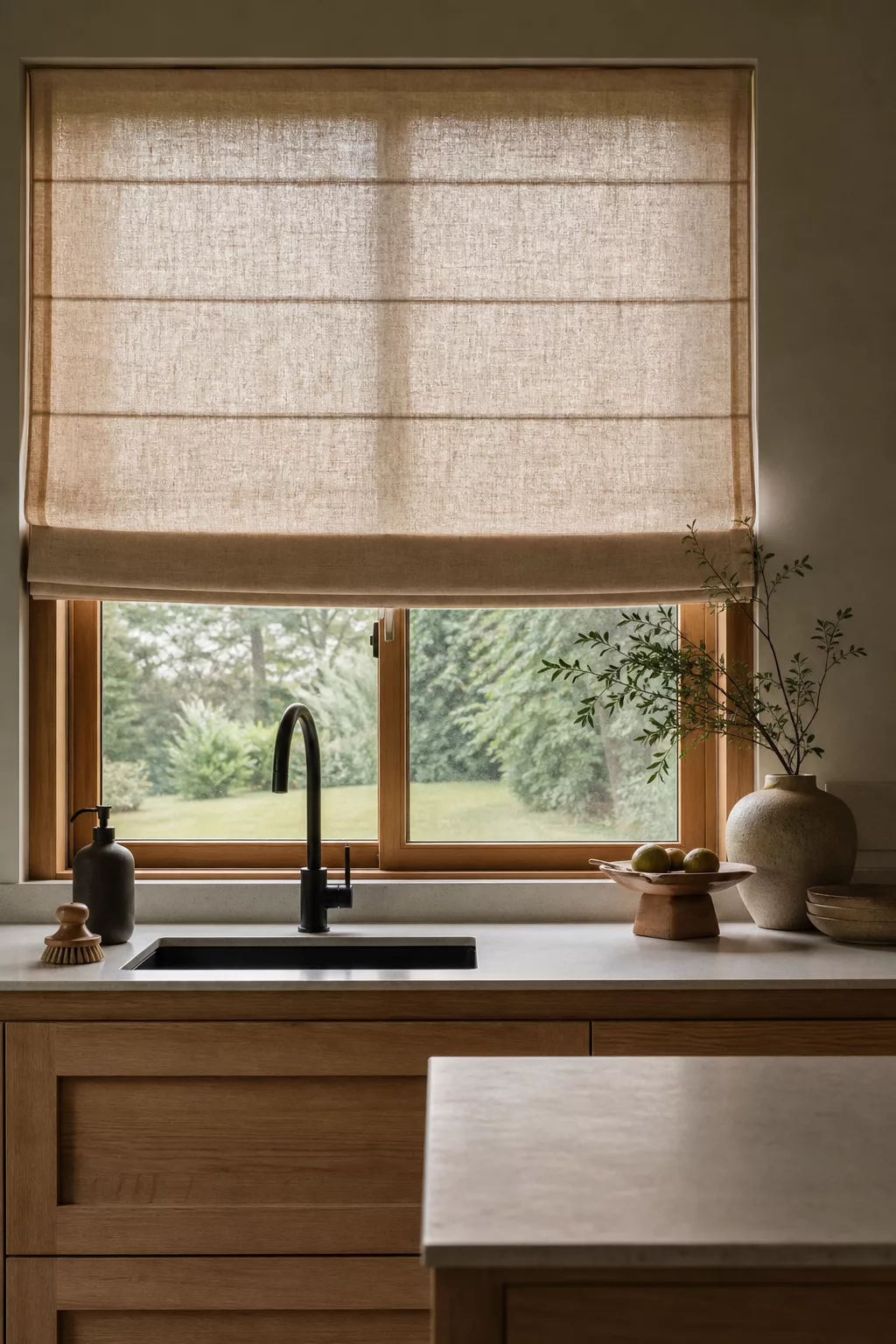 Linen roman shade and oak window frame in a Japandi kitchen design ideas scheme