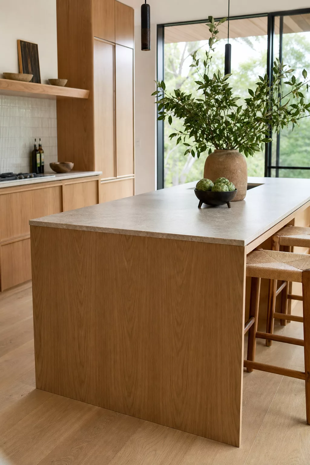 Waterfall oak island with stone counter, a top pick among Japandi kitchen island designs