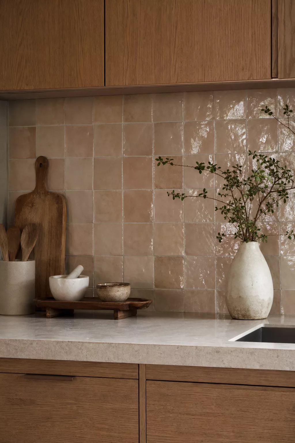 Clay-toned zellige tile backsplash in a Modern Japandi Kitchen Ideas design with oak cabinetry